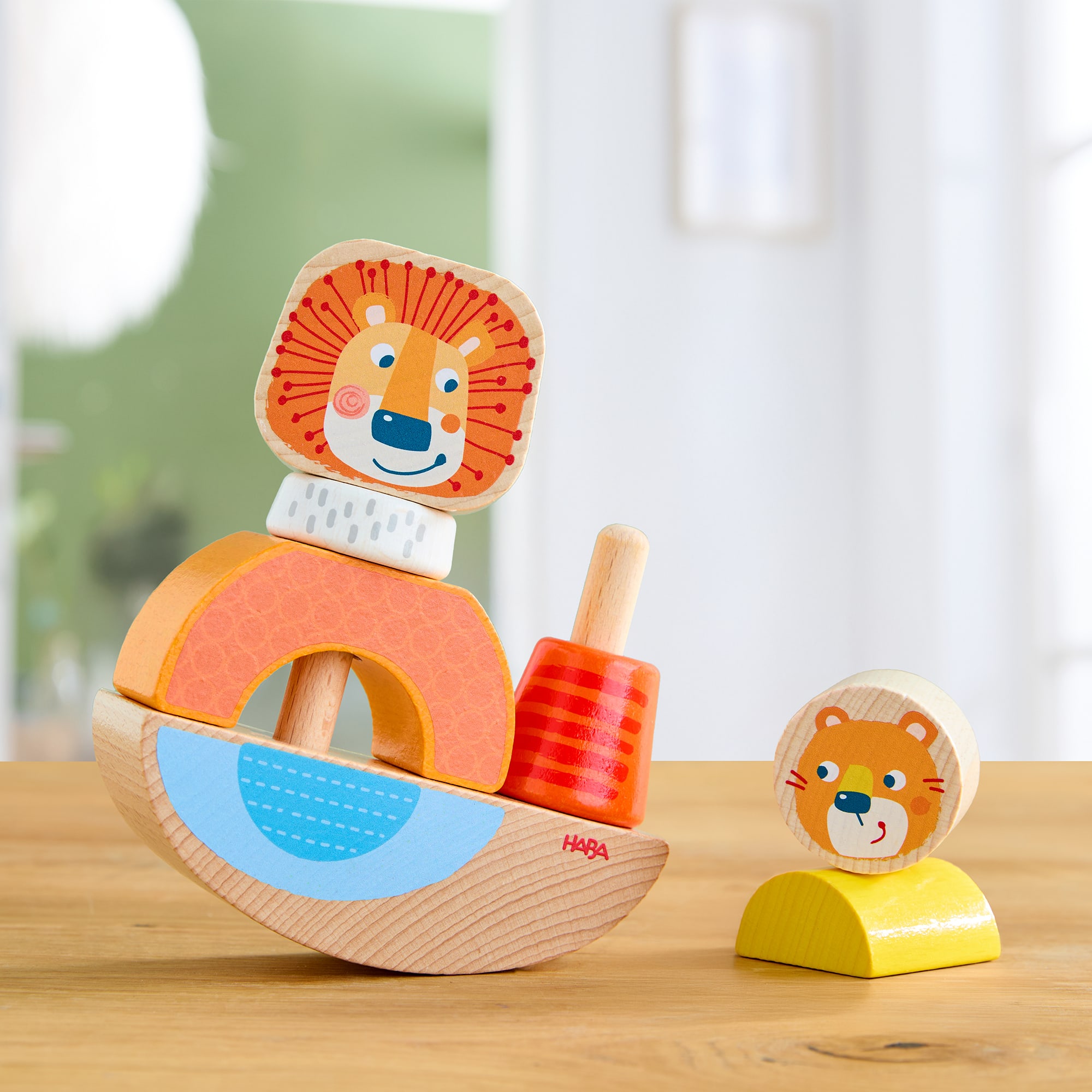 Steckspielzeug, HABA, Orange – Besonderheit: Wippfunktion unterstützt erstes Verständnis für Balance