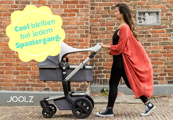 Frau schiebt Kinderwagen mit Sonnensegel. Kinderwagenzubehör: Cool bleiben bei jedem Spaziergang!